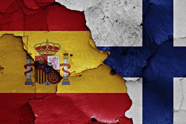 Flags of Spain and Finland painted on cracked wall
