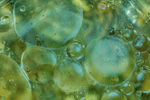 Abstract oil in water using natural light in blue and green tones. Good for wallpaper or background
