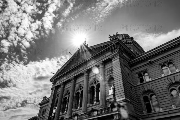 Beautiful Bundeshaus Parliament Building or Federal Palace in a Sunny Day with Sunbeam and Lens Flare in City of Bern, Canton Bern, Switzerland.