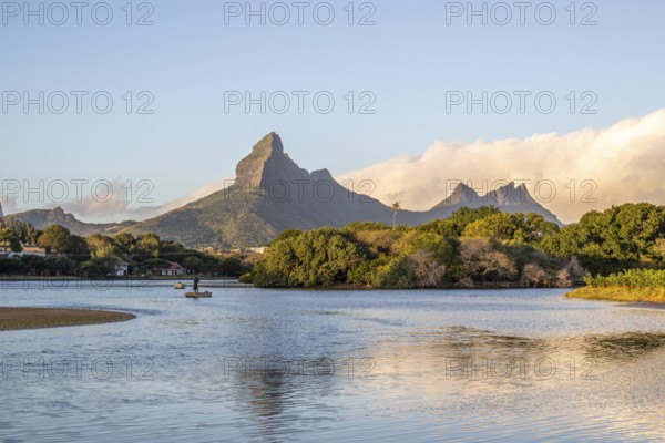 A bay on a river. Dream beach in a pastel-coloured sunset on a holiday island. A gently sloping beach on the island of Mauritius, Tamarin