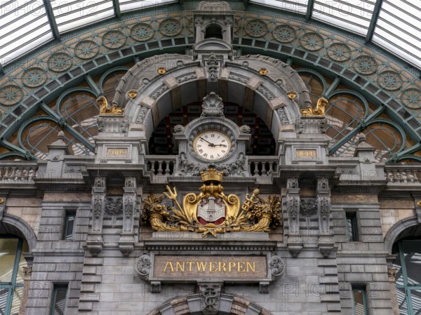 Opulent, historic interior view of the old Antwerp-Centraal terminus station with the famous old clock on the façade, Antwerp, Flanders, Belgium, Europe