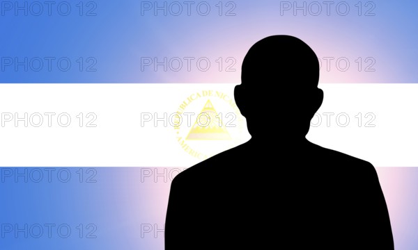 The Nicaragua flag and the silhouette of an unknown man