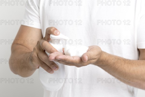 Close up man hand spraying shaving foam