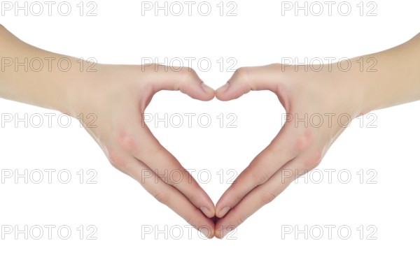Female hands in the form of heart isolated on white background