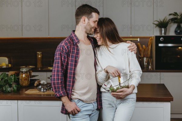 Front view loving couple preparing food home