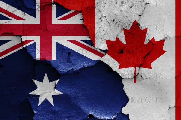 Flags of Australia and Canada painted on cracked wall