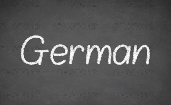 German lesson on blackboard or chalkboard. written in white chalk