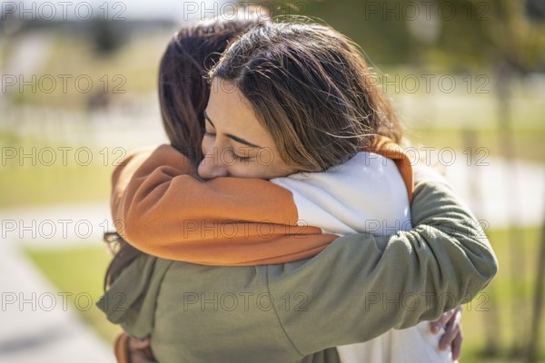 Two women hugging each other. Support concept