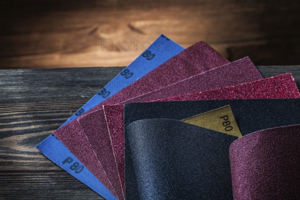 Sandpaper assortment on vintage wood background