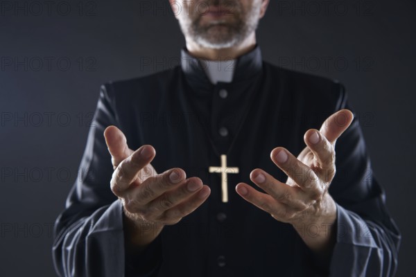 Priest open hands arms praying offering oblation