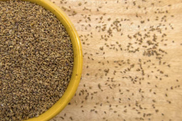 Top View of Ajwain, Carom Seeds, Thymol Seeds, Bishop's Weed in a Yellow Bowl, Closeup