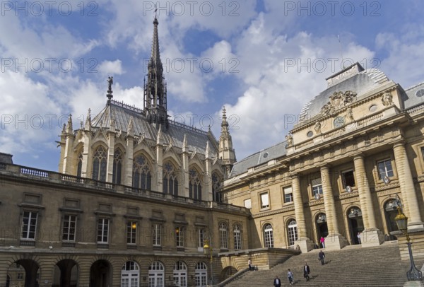 Sainte-Chapelle towers over the buildings of the Palais de Justice. Paris, France, Europe