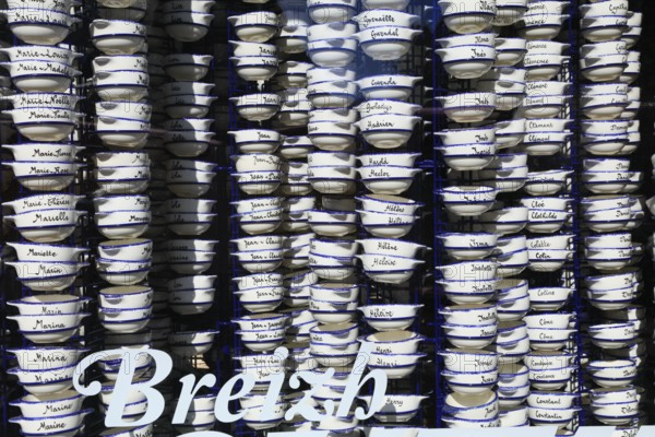 Pottery bowls with first names in the window of a souvenir shop, old town of Vannes, Breton Gwened, Morbihan department, Brittany Breizh region, France, Europe