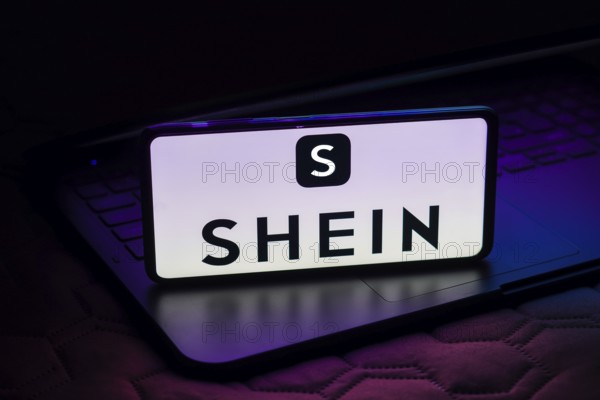 In this photo illustration, the Shein logo is displayed on a smartphone screen