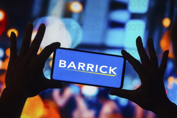 In this photo illustration, the Barrick Gold Corporation logo is displayed on a smartphone screen