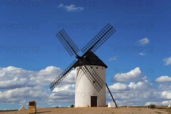 A windmill under a clear, cloudy sky, Campo de Criptana, Ciudad Real province, Castilla-La Mancha, Don Quixote Route, Spain, Europe