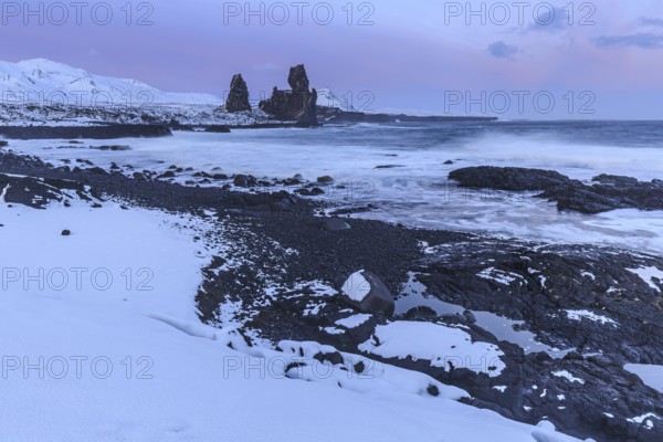 Rocks and surf on the coast, evening light, sun, snow, winter, Arnarstapi, Snaefellsnes, Vesturland, Iceland, Europe