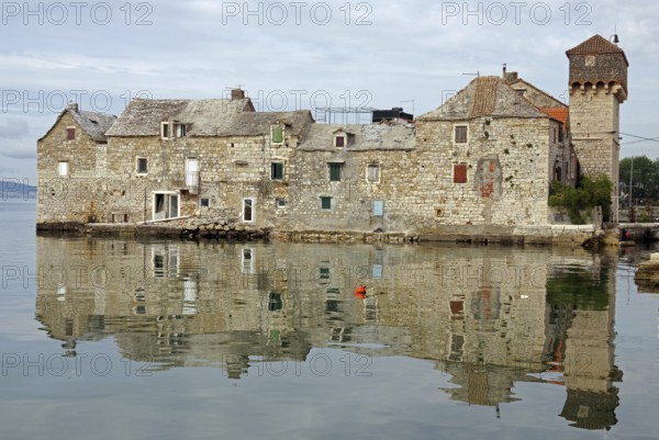 Old fortification from the Mediterranean reflected in the water, town of Kastela, Split, Dalmatia, Croatia, Europe