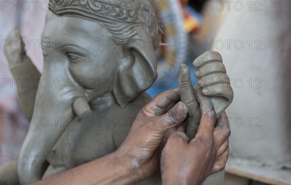Artisan work on idols of the elephant-headed Hindu deity Ganesha at a workshop ahead of the Ganesh Chaturthi festival, in Guwahati, Assam, India on 3 September 2024