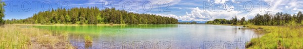 A panorama of a clear lake with vibrant colours and a surrounding forest, Osterseen