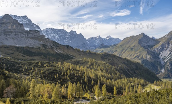 Mountain panorama with steep rocky peaks, yellow-coloured larches in autumn, view of Laliderspitze, Dreizinkenspitze and Spritzkarspitze peaks, hike to the summit of Hahnkampl, Engtal, Karwendel, Tyrol, Austria, Europe