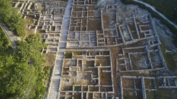 Drone shot, first morning light, Close aerial view of an ancient ruins site, detailed walls and paths, surrounded by nature, Kamiros, Archaeological site, Ancient city, Foundation of Doric Greeks, Rhodes, Dodecanese, Greek Islands, Greece, Europe