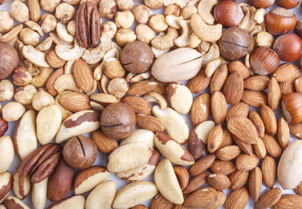 Background and texture made from different kinds of nuts. hazelnut, brazil nut, almond, pumpkin seeds, cashew. top view