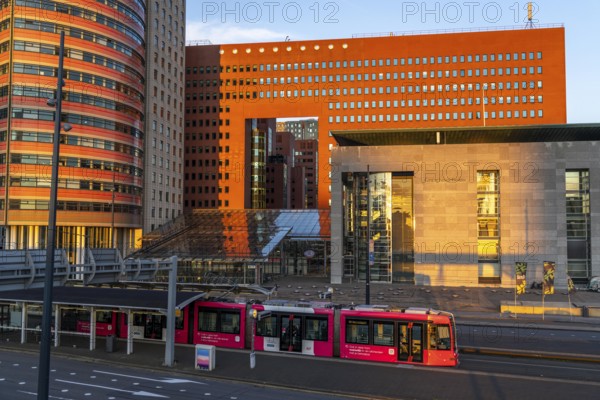 Courthouse, right, building of the public prosecutor's office, red, on Wilhelminaplein, on the Nieuwe Maas, Kop van Zuid, Rotterdam, Netherlands