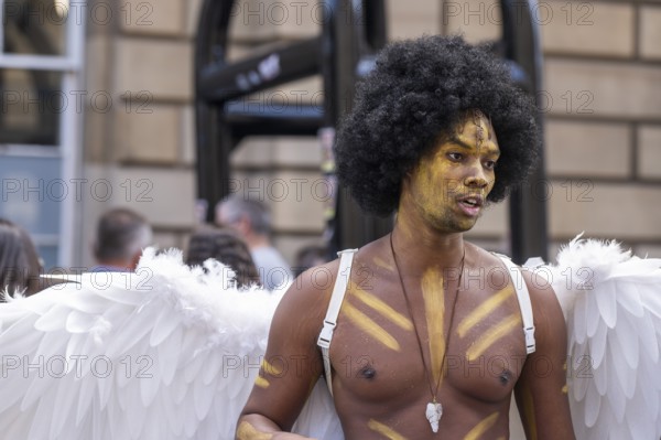 Street performers with angel wings, world's largest cultural festival The Fringe, High Street, Edinburgh, Scotland, United Kingdom, Great Britain, Europe