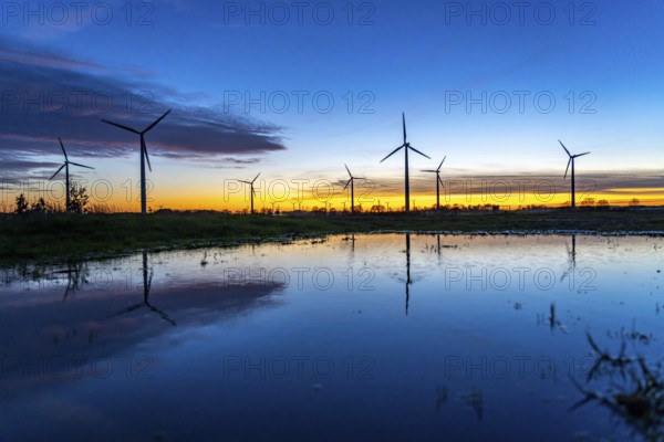 Wind farm near Holzweiler, town of Erkelenz, wind turbines, rain puddle, North Rhine-Westphalia, Germany, Europe