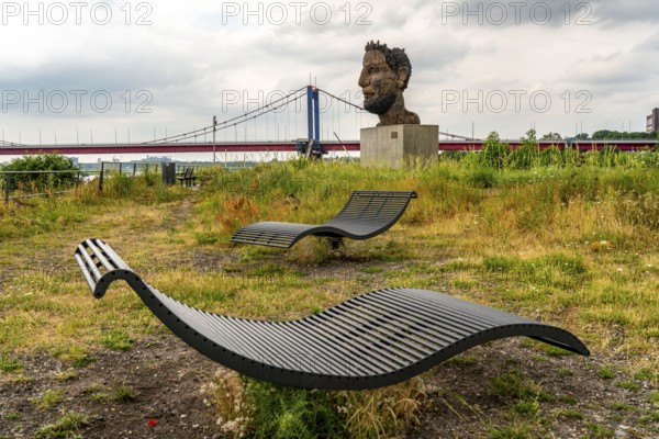 The sculpture Echo of Poseidon, Since 2016, the 10 m high sculpture by Markus Lüpertz has been standing on Mercatorinsel, the sculpture was erected from 75 individual parts on the occasion of the 300th harbour birthday, Friedrich-Ebert-Brücke over the Rhine, Duisburg, North Rhine-Westphalia, Germany, Europe