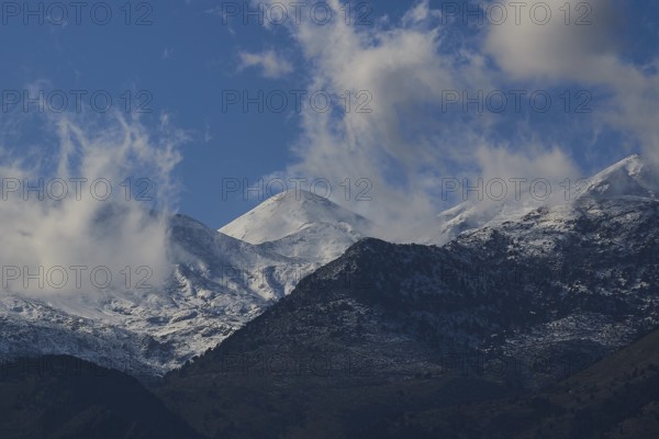 Mountain peaks with snow and clouds under a blue sky, Lefka Ori, White Mountains, mountain massif, west, Crete, Greece, Europe