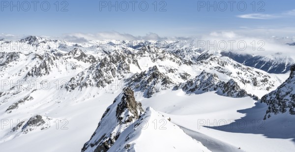 Mountain ridge of Piz Kesch, ascent on Piz Kesch or Piz d'Es-cha in winter, spectacular mountain landscape, view of mountain panorama with glacier Vadret da Porchabella, Albula Alps, Rhaetian Alps, Grisons, Eastern Switzerland, Switzerland, Europe