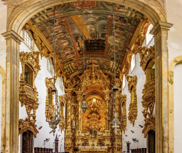 Interior and altar of a historic baroque church richly decorated with gold leaf ornaments and frescoes in city of Recife, Recife, Pernambuco, Brazil, South America