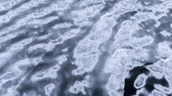 Frozen lake in early winter. Region of La Mauricie. Province of Quebec. Canada