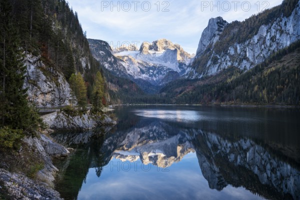 The Vordere Gosausee lake in autumn with a view of the Dachstein mountain range. The Gosaukamm on the right. Good weather, blue sky. Reflection. Vorderer Gosausee, Gosau, Gosau valley, Salzkammergut, Upper Austria, Austria, Europe