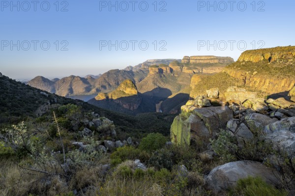 Sunset at Blyde River Canyon with Three Rondawels peak, view of canyon with Blyde River and Mesa mountains in the evening light, Upper Viewpoint, canyon landscape, Panorama Route, Mpumalanga, South Africa, Africa