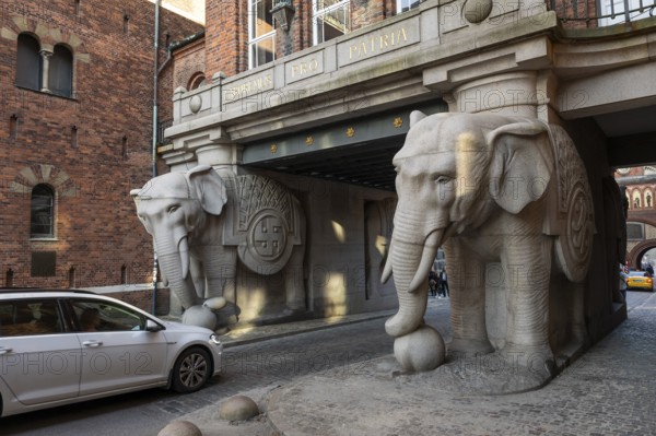 Monumental stone elephants with Indian swastika, elephant gate or elephant portal or elephant portals, designed by architect Vilhelm Dahlerup, Carlsberg district, Copenhagen, Denmark, Europe