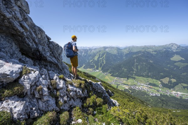 Mountaineer enjoying the view, ascent to Hochunnütz, Unnütz crossing, Brandenberg Alps, Tyrol, Austria, Europe