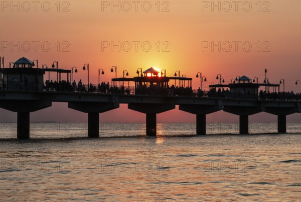 Sunset at the pier in Miedzyzdroje, Western Pomerania, Poland, East Europe, Europe