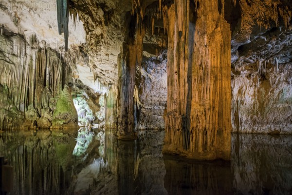 Huge stalactites and underground lake, stalactite cave, Grotta di Nettuno, Neptune Grotto, Capo Caccia, near Alghero, Sardinia, Italy, Europe
