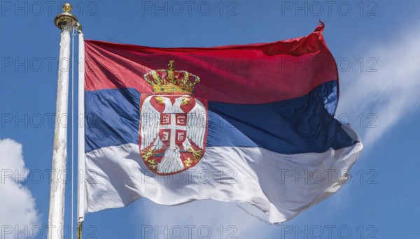 Flags, the national flag of Serbia flutters in the wind