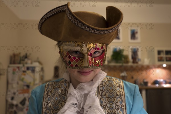 Girl, 10 years old, with carnival mask, Mecklenburg-Western Pomerania, Germany, Europe