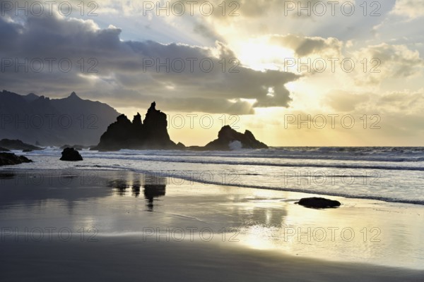Dramatic clouds with rock formation at sunset on the beach of Playa de Benijo, Tenerife, Canary Island, Spain, Europe