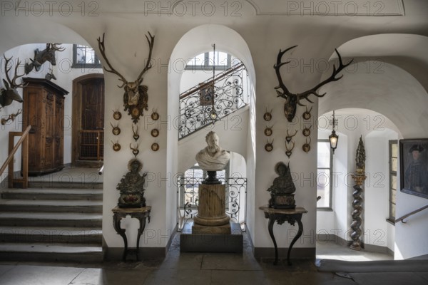 Staircase with hunting trophies and bust of the heraldist Carl Mayer von Mayerfels (1825-1883) in Meersburg Castle, museum, place of interest, Lake Constance, Lake Constance district, Baden-Württemberg, Germany, Europe
