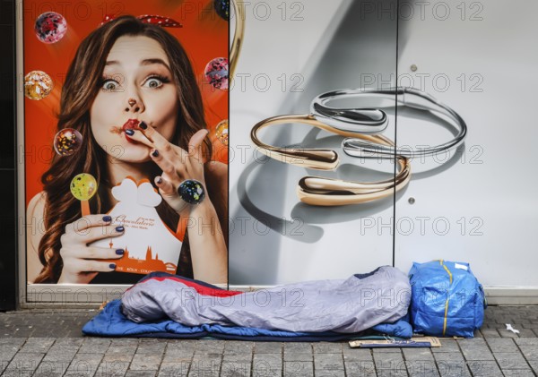 Cologne, North Rhine-Westphalia, Germany - Cologne city centre in times of the corona crisis during the second lockdown, the shops are closed, a homeless person sleeps on the street