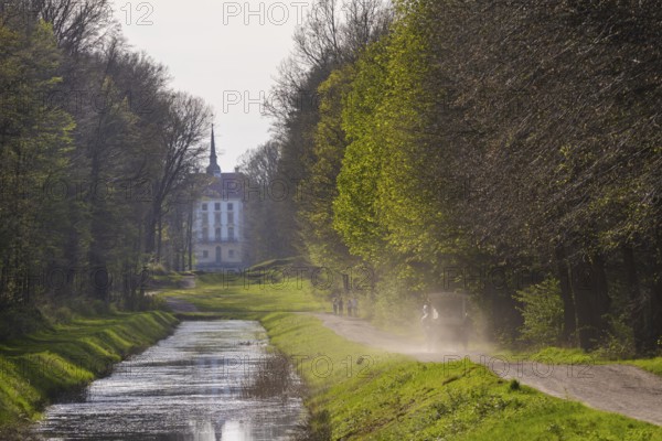 Canal between the hunting lodge and the Fasanenschlösschen with a carriage on a round trip, Moritzburg, Saxony, Germany, Europe