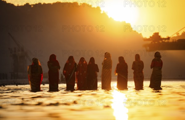 Hindu devotees perform rituals as they offer prayers to the Sun god in the bank of Brahmaputra river on the occasion of the 'Chhath Puja' festival in Guwahati, Assam, India on 7 November 2024. Chhath Puja is a significant Hindu festival celebrated primarily in the Indian states of Bihar, Jharkhand, Uttar Pradesh, and in Nepal. Dedicated to the worship of the Sun God (Surya) and his wife Usha (also referred to as Chhathi Maiya), this festival seeks blessings for prosperity, health, and longevity