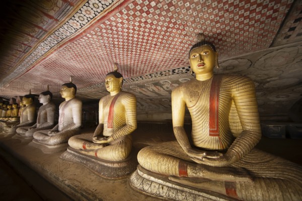 Seated Buddha statues in the Dambulla cave temple, Dambulla, Central Province, Sri Lanka, Asia