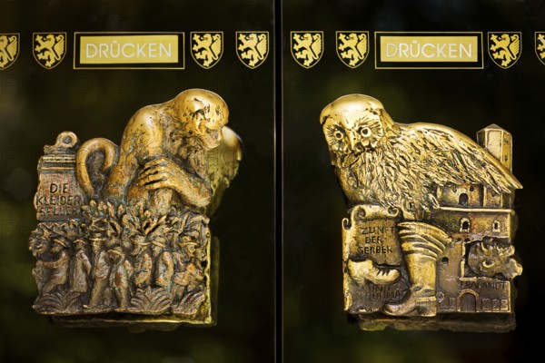 Door handles on the glass doors of the town hall with motifs from the history of the city of Braunschweig, Lower Saxony, Germany, Europe